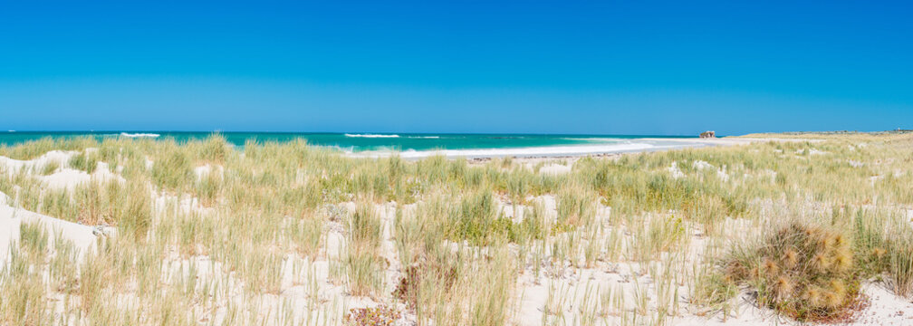 Blue skies white sands & turquoise ocean at two rocks beach