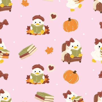 cute duck illustration pattern with autumn elements. The duck wears a beret and reads a book, sitting on fallen leaves, surrounded by pumpkins and hearts. A cozy armchair is also visible, fall season