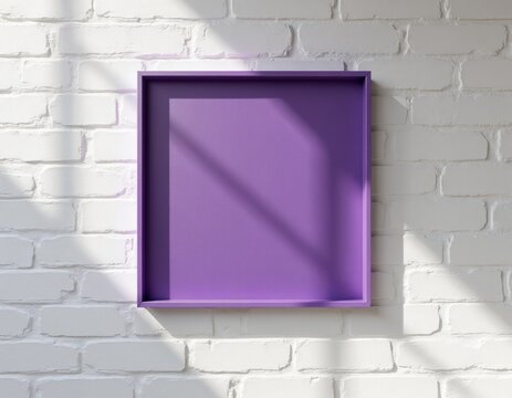 Empty purple square frame placed on white brick wall. Natural light casts diagonal shadows on surface. Modern interior decor backdrop for art.