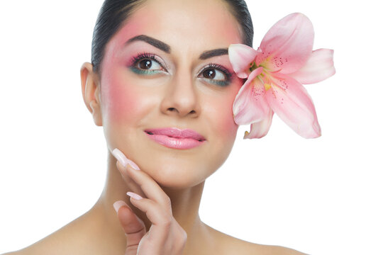 Portrait of a beautiful woman with flower