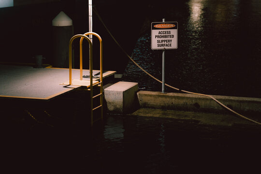 Yellow metal handrail at the dockside