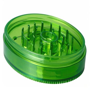 Translucent green oval-shaped device with internal teeth for grinding