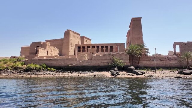 Majestic view of the historic philae temple complex on agilkia island, sailing along the nile river in aswan, upper egypt landmark