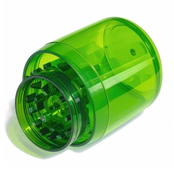 Translucent green cylindrical herb grinder with sharp teeth