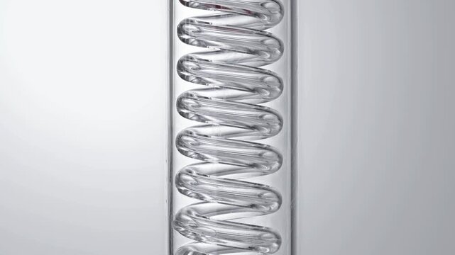 Macro video of pure clear liquid flowing in glass spiral condenser tube, medical science chemistry lab cosmetic skincare serum distillation