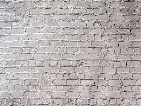 White painted brick wall texture background with rustic pattern for architecture and creative design.