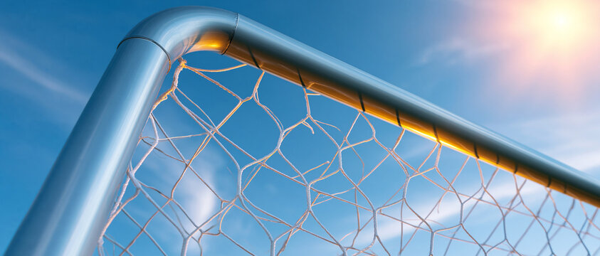 Soccer goal against blue sky during a sunny day.
