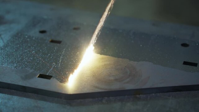 Precision laser cutting metal plate with bright molten seam, glowing sparks, and industrial fabrication detail, with laser, cutting, metal, plate detail, showing spark, molten, fabrication