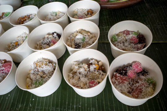 Colorful klepon, cenil, red and white klepon, gethuk, Asian traditional snacks on white bowl
