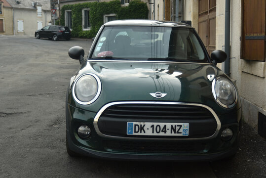 St Amamnd Montrond - France - 14 july 2026 - Front view of a Mini Cooper F56 parked on a quiet residential street in a small town. 