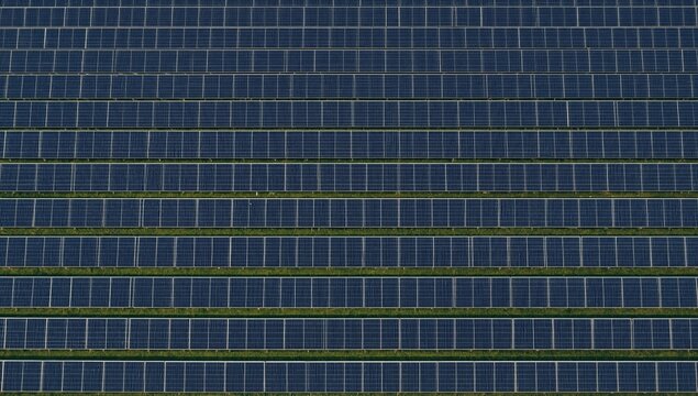 Aerial view of solar panels in a large field