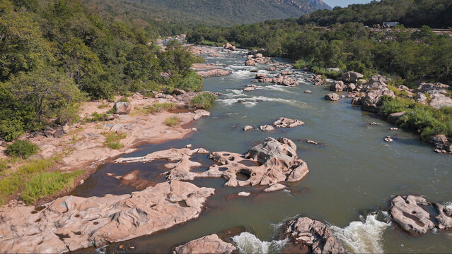 Early morning drone photograph of Crocodile River, Mpumalanga, South Africa, July 2026, featuring river flow and rocky terrain.