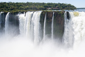 Iguazu falls' devil's throat showcasing a massive volume of water cascading over the dramatic cliff into a cloud of mist © Nuria Gonzalez Sanch