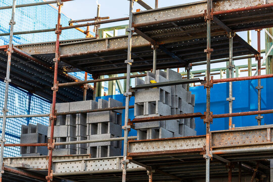 multi storey commercial worksite with scaffolding rising up around building under construction