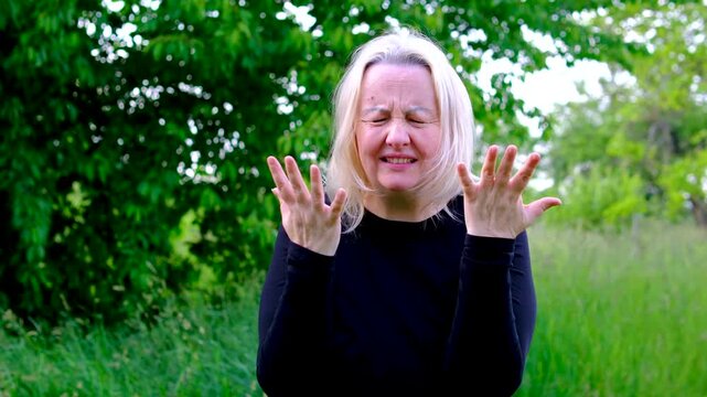 Agitated gestures raised voice reveal intense dissatisfaction as woman throws hands outward confronts the situation. The scene captures outrage disbelief annoyance and emotional confrontation.