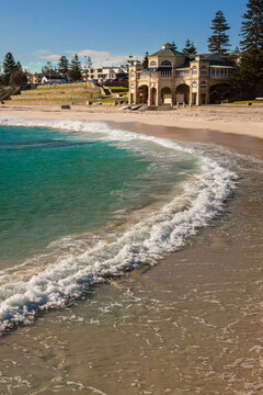 Low angle view of gentle waves on the beach in front of the Historic Cottesloe Pavillion