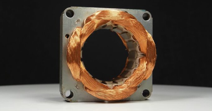Large stator of electric motor with copper coil from household appliances