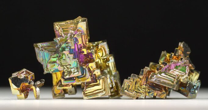 Bismuth crystals. Bismuth - chemical element with symbol Bi and atomic number 83. Post-transition metal and one of pnictogens. Synthesized bismuth crystal. Iridescent coloration is due to oxide film