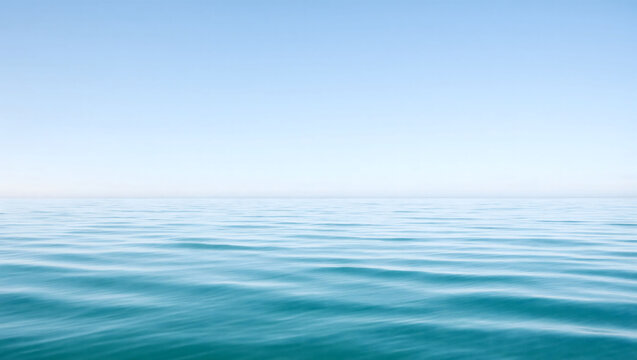 Minimalist Calm Ocean Horizon Under a Clear Blue Sky with Gentle Ripples
