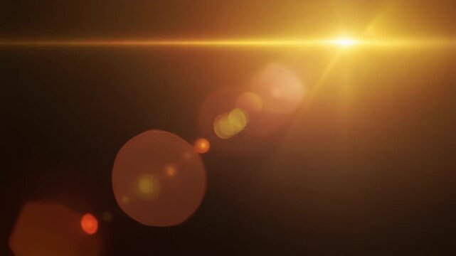 Warm golden sunset cinematic light leak overlay with honey gold, amber and peach gradients, realistic lens flare, optical bloom and seamless looping motion for premium video editing on dark background