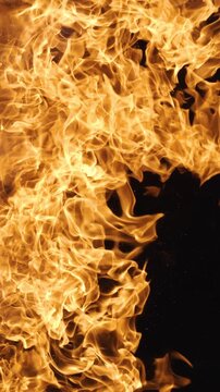 Vertical video Abstract orange fire flames background texture.