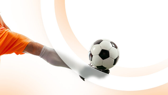 Soccer player kicking ball through flowing white graphic shapes on bright background. Concept of football ads, sportswear branding, tournament promo and commercial sports marketing materials.