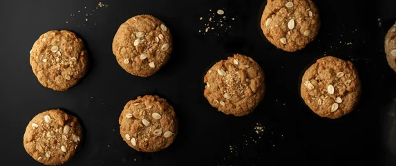 Oatmeal Cookies With Nuts On Black Background - Top View, Warm Tones © Giovanni