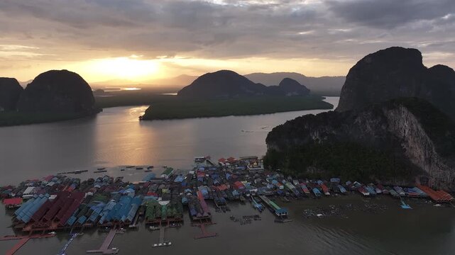 Floating fishing village aerial view at sunrise, Thailand