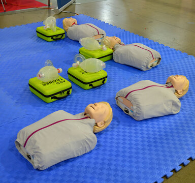CPR training kit, green case for automated external defibrillator AED, transparent Ambu bag for artificial ventilation of the lungs