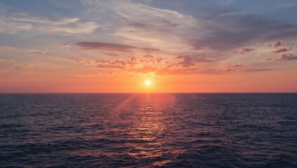 Fototapeta premium Sunset Over the Ocean - Calm Waters, Soft Light, Wide Angle