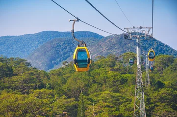 Cable car ropeway cabins in cableway above the forest in mountains in Dalat in Vietnam in Asia © alexkoral