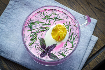 Chilled summer vegetable soup with sour cream and beetroot broth © Yingko