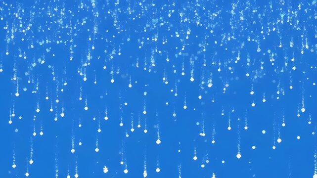 Sparkling particles falling gently against a vibrant blue background with subtle camera movement
