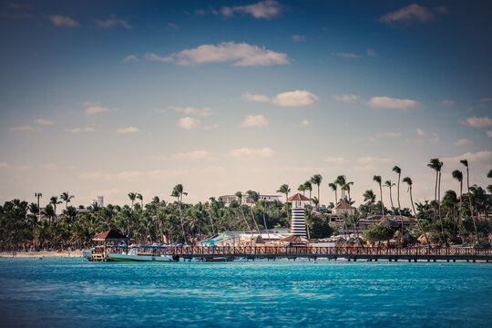 Pier and lighthouse on the tropical beach of Bayahibe coastal beach in Saona Island cruise  Dominican republic