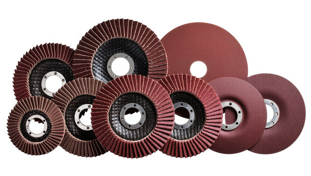 Isolated group of red abrasive flap discs and grinding wheels for industrial applications