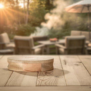 Wooden table with copy space and blurred summer barbecue background