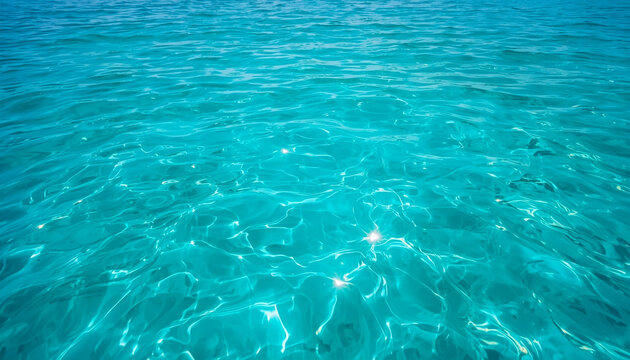 Clear turquoise ocean water. Calming sea surface with sunlight 