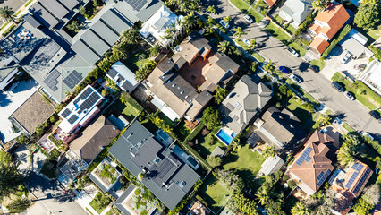 Top-Down Aerial View of Residential Homes with Rooftop Solar Panels in Sydney © red.io