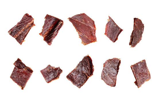 Set of dried pieces of beef isolated on a white background.