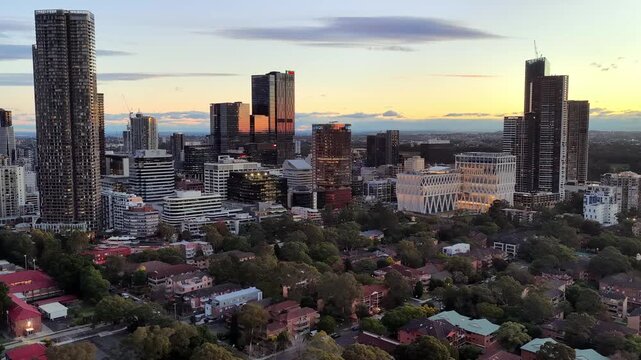 Long aerial cityscape of Parramatta city skyline in Western Sydney at sunset.