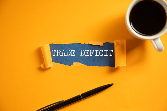 Trade deficit on white paper background