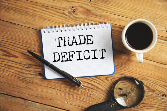 Trade deficit on white paper background