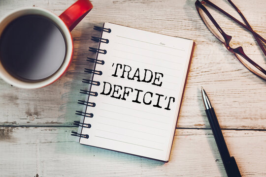 Trade deficit on white paper background