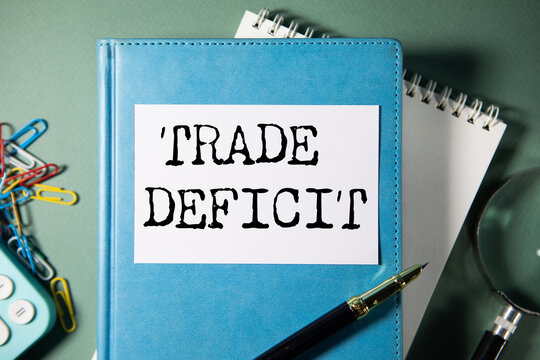 Trade deficit on white paper background