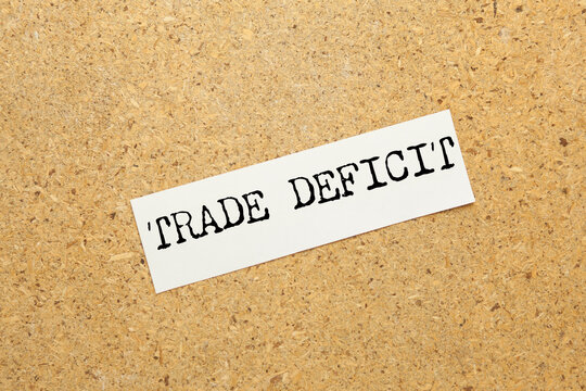 Trade deficit on white paper background