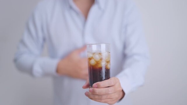 man hand stop and refuse gesture to carbonated soft drink, feeling Abdominal pain after drinking soda water, bloating and gas in digestive system, stomach ache, Acid reflux, Heartburn and Gastritis
