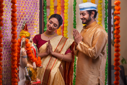 Maharashtrian Couple praying to Lord Ganesha