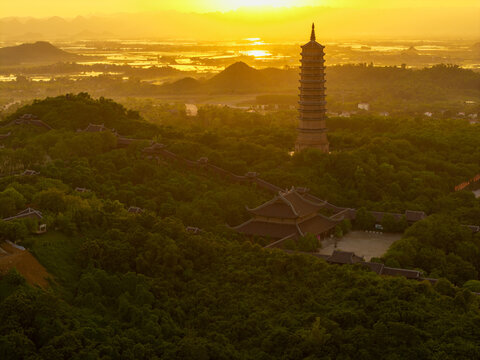 Aerial view of Bai Dinh pagoda and mountains at sunset in Ninh Binh province, Vietnam