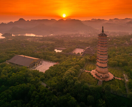 Aerial view of Bai Dinh pagoda and mountains at sunset in Ninh Binh province, Vietnam