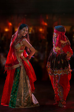 Gujrati couple performing Garba on stage